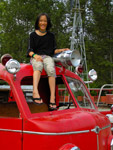 Claire sitting on the fire truck cab at Remlinger Farms.